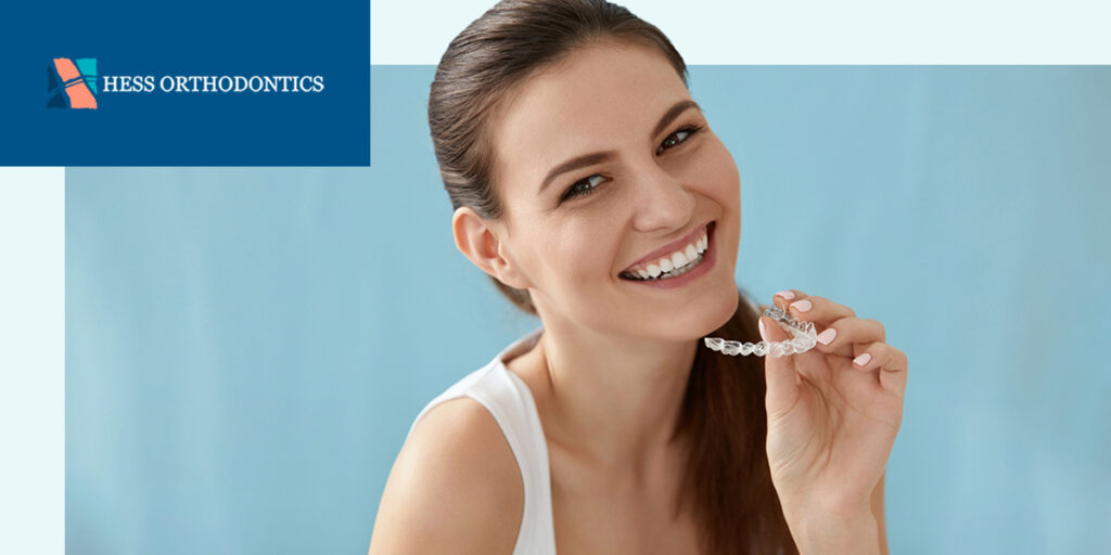 woman with clear aligners smiling 
